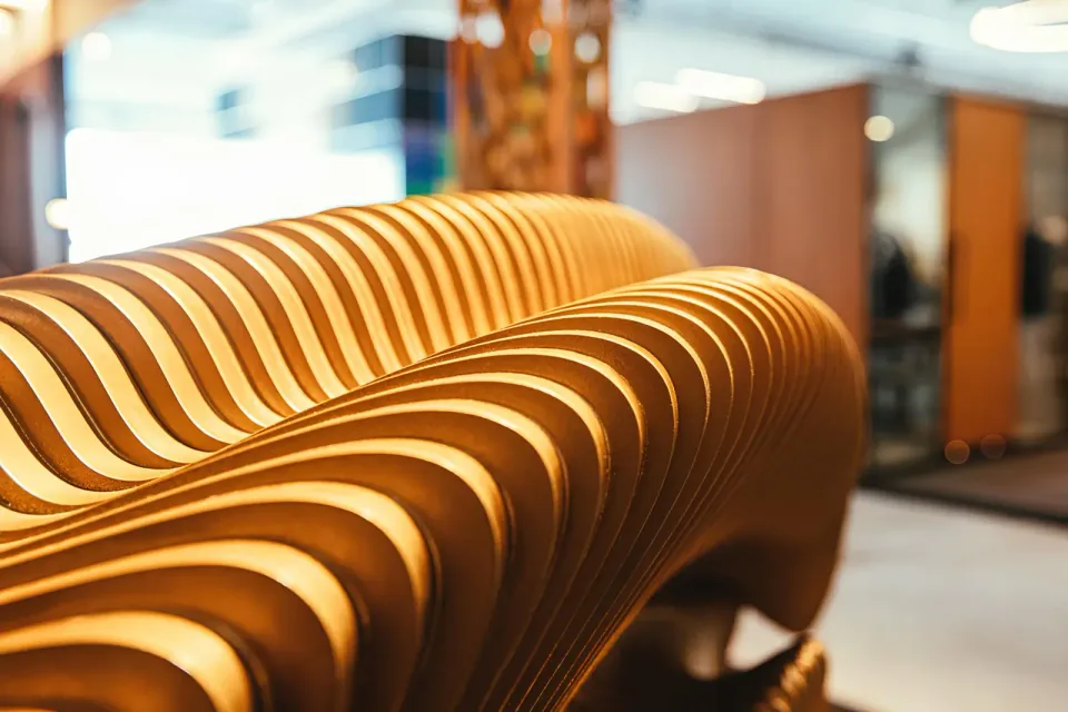 D Reception Desk, close-up of rounded plywood ribs forming the public-facing counter.