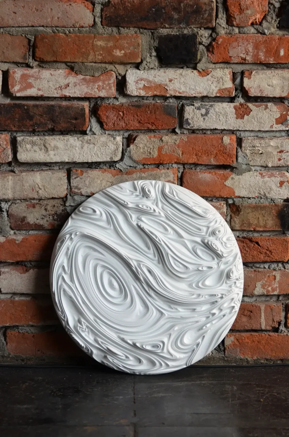 Jupiter Round Panel 01, primo piano di un vortice circolare nel rilievo.