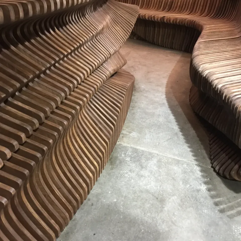 Dubai Reception Desk, adjacent plywood sections arranged on the workshop floor before installation.
