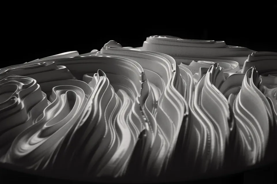 Low side angle revealing the sculptural depth of a circular Jupiter wall panel.