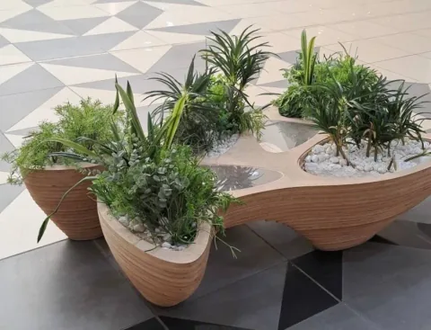 Rain gatherer table, Rain Gatherer table used as an indoor planter with tropical foliage.