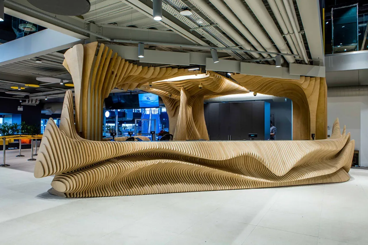 Explorium, Reception area and furniture, completed museum installation showing the ribbed reception counter beneath the timber canopy.
