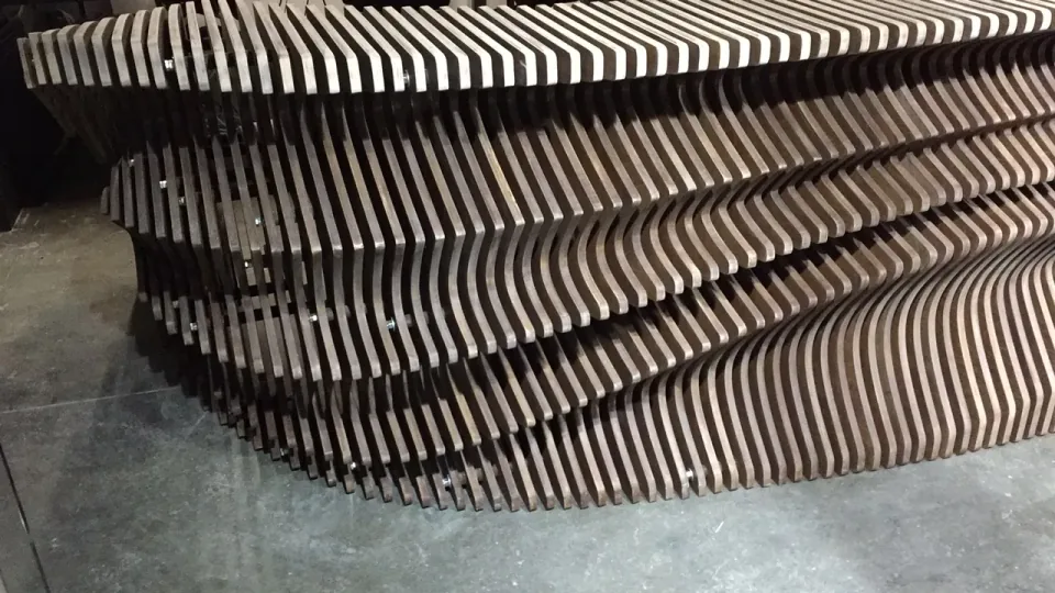 Dubai Reception Desk, unfinished side section showing the layered plywood edge construction.
